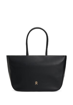 Zwarte leren totebag met twee handvatten en een klein goudkleurig logo-embleem centraal geplaatst vlak bij de onderkant.