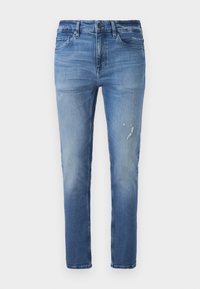 Light blue denim jeans with a straight cut, featuring a faded finish and slight distressing on the front. Standard five-pocket design.