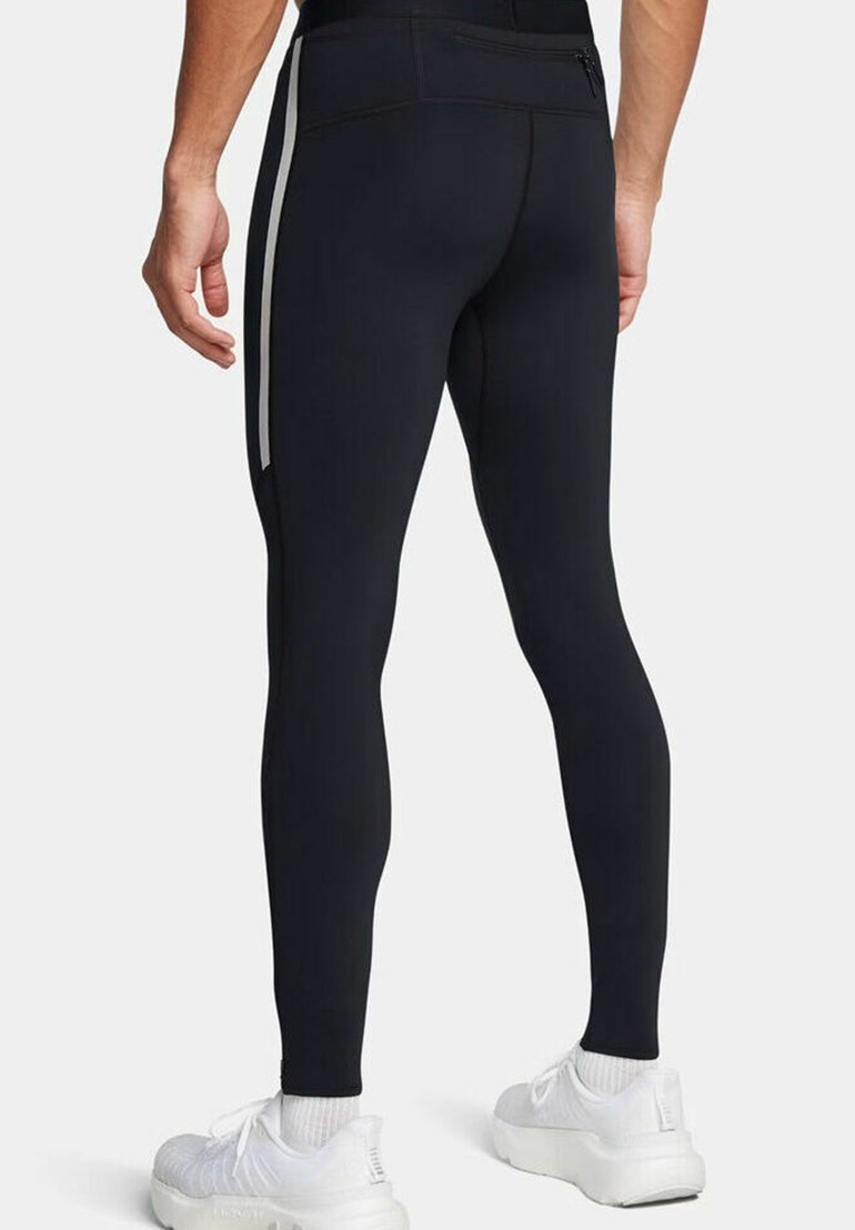 Schwarze Sportleggings mit glatter Textur, ausgestattet mit seitlichen Reißverschlusstaschen und weißen Streifen an den äußeren Kanten. Körpernahe Passform.