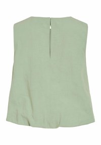 Veste sans manches vert clair avec un dos coupe droite et une fente verticale centrale en haut, en tissu doux.