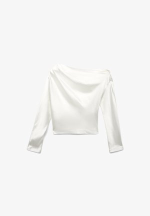 Top a maniche lunghe e spalle scoperte realizzato in un morbido tessuto bianco. Presenta un design accorciato con morbide drappeggiature e maniche aderenti.