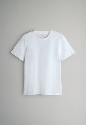 Hvid bomuld t-shirt med korte ærmer, rund hals og en glat tekstur. Enkel design uden mønstre eller accenter.