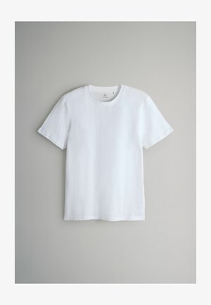 Valge puuvillane T-särk lühikeste varrukatega, ümmarguse kaelusega ja sileda tekstuuriga. Lihtne disain, ilma mustrite või aktsentideta.
