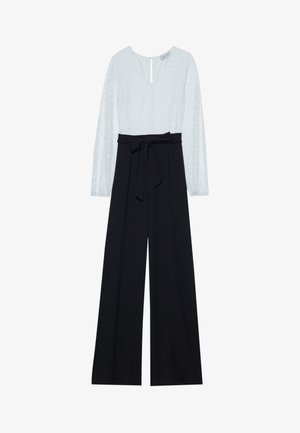 Jumpsuit with a light blue, patterned top featuring long sleeves and a deep V-neck, and black wide-leg trousers with a belted waist.