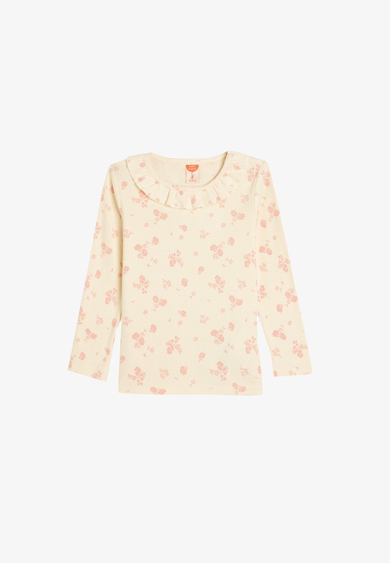 Ribbed long-sleeve top in light cream with small pink floral pattern; features a ruffled neckline and soft, textured fabric.
