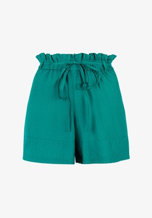 Shorts taille haute bleu sarcelle avec taille élastique à volants et ceinture en tissu nouée, présentant une texture subtilement à pois et une coupe ample.