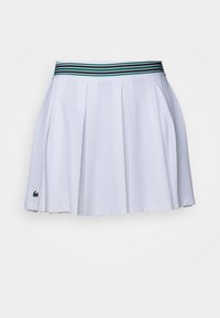 Λευκή πλισέ φούστα τένις από υφασμάτινη υφή, με λωρίδα ελαστικής μέσης σε μαύρο, πράσινο και μπλε χρώμα, και λογότυπο στο στρίφωμα.