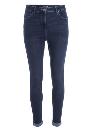 Donkerblauwe skinny jeans van denim met een hoge taille, opgerolde manchetten, voorzakken en contrasterende stikdetails. Het materiaal lijkt glad en rekbaar.