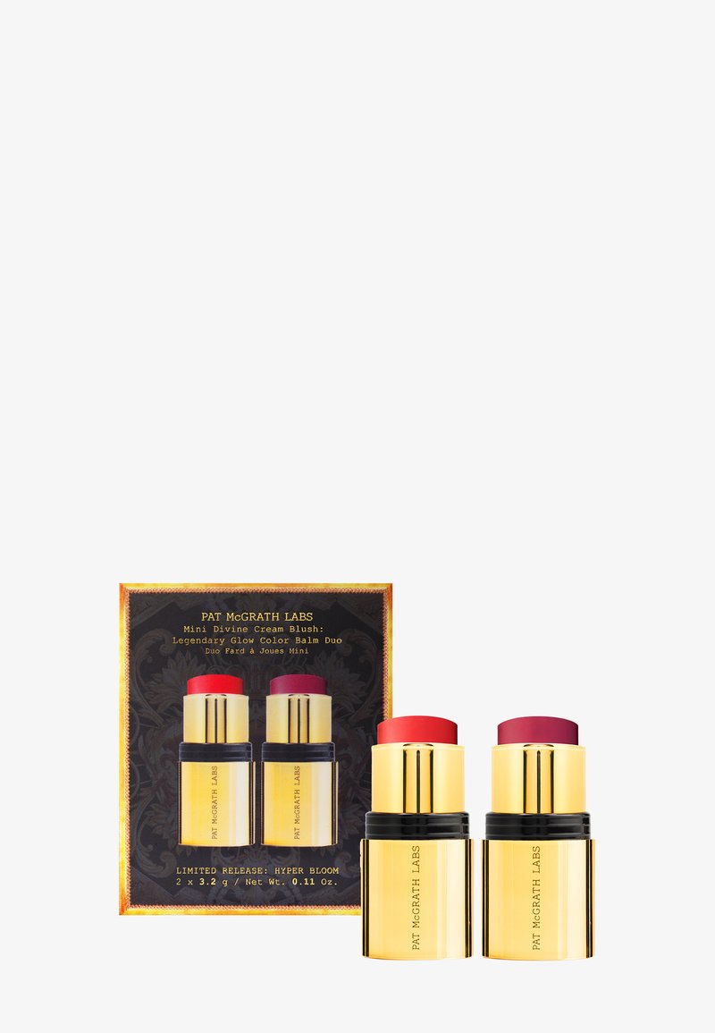 Pat McGrath Labs Mini Divine Cream Blush Duo in einer gold-schwarzen Verpackung, die zwei Creme-Rougesticks enthält, einen roten und einen rosa.