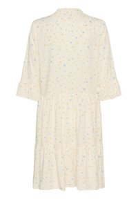 Ein cremefarbenes Blumenkleid mit einem Design aus Rüschensäulen, einem gestuften Rock und kleinen bunten verstreuten Blumen in Pastellfarben.