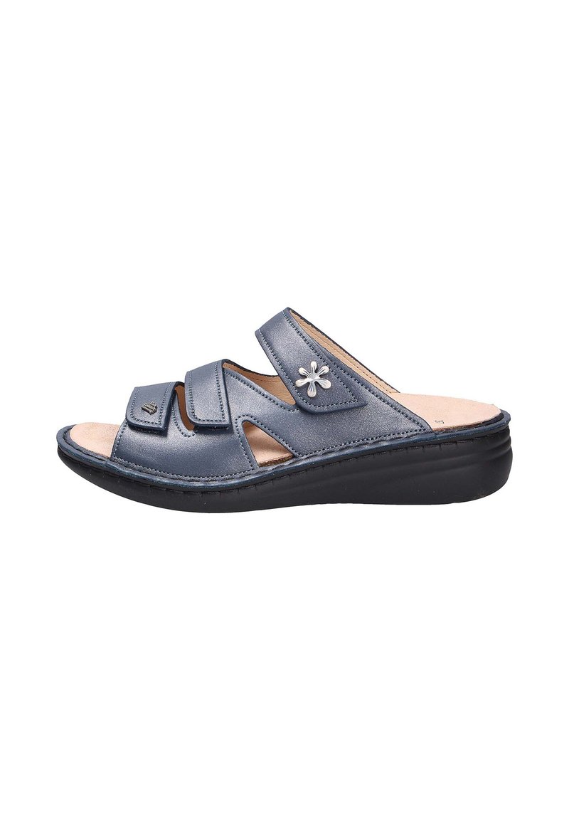 Dark blue slide sandal featuring three crossed straps, small decorative flower accent, and a cushioned insole with a black sole.