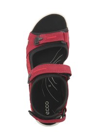 Raudoni sandalai su sintetiniu viršumi, reguliuojamais Velcro dirželiais, paminkštintu juodu vidpadžiu ir balta gumine padu. Viduje nurodytas dydis 38.