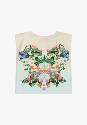 Chemise couleur crème avec imprimé jungle symétrique comprenant des toucans, des léopards, des fleurs tropicales, des feuilles et des coquillages aux couleurs vives.