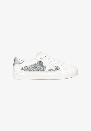 White low-top sneaker with silver glitter panel and star detail, white laces, and a matching white rubber sole.
