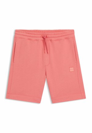 Shorts rose corail avec cordon de serrage, poches latérales, taille élastique et petit patch logo embossé sur la cuisse droite.