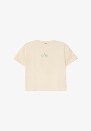 Cream-colored cropped T-shirt with short sleeves and green text "The Club House Tennis Society" centered on the front.