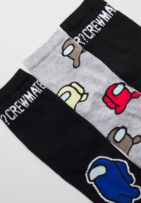 Crew socks in three colors: black, gray, and white, featuring cartoon crewmates in various colors. Fabric is soft with ribbed tops.