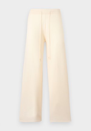 Bredbenede cremefarvede bukser med elastisk talje og snøre, vist mod en lys baggrund.