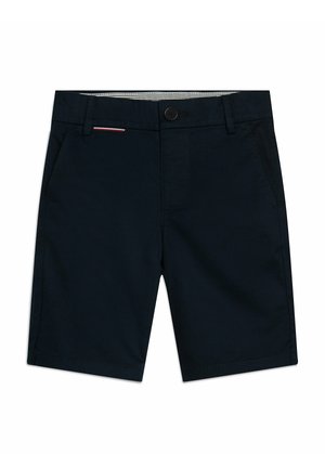 Mørkeblå shorts lavet af bomuldsstof, med en frontlukning med knap, sidelommer og en subtil rød og hvid detalje på taljebåndet.