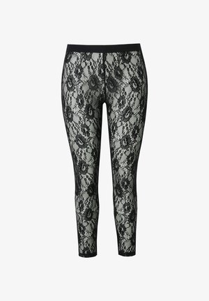 Schwarze Spitzenleggings mit floralem Muster, elastischem Bund und figurbetonter Passform, die eine durchsichtige Textur mit solidem Rücken präsentieren.