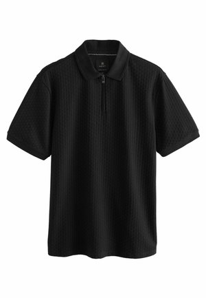 Polo noir à manches courtes avec motif vertical texturé et demi-fermeture éclair au col, coupe régulière.