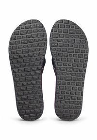 Sole in gomma nera per sandali, con un pattern a grip testurizzato e quadrati in rilievo, caratterizzato da bordi arrotondati e un bordo rialzato lungo i lati.