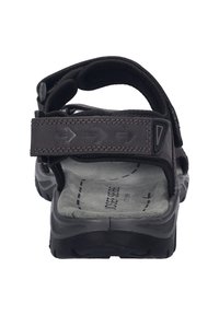 Czarne sandały z regulowanymi paskami, wyściełaną szarym wnętrzem, trwałą podeszwą i akcentami w kształcie strzały na pasku. Bez osłony na palce.