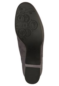 Gray suede shoe sole featuring intricate embossed designs and text, with a smooth black rubber heel and patterned grip surface.