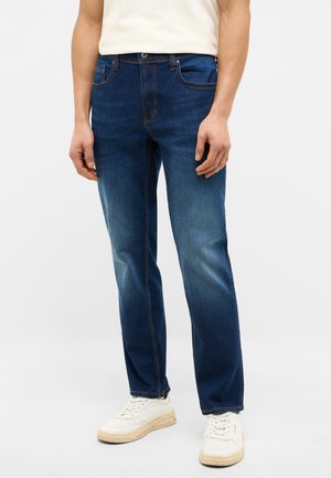 Dark blue denim jeans with a straight-leg cut, light fading at the thighs, five pockets, and contrasting orange stitching details.