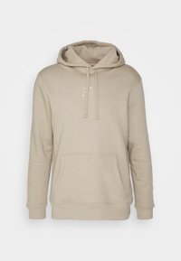 Beige mikina s kapucí a šňůrkou, přední kapsou a vyšitým logem "GAP". Měkká látka, dlouhé rukávy a žebrované manžety. Klasický design.