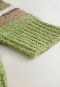 Wool knit fabric in vibrant green with a textured, ribbed design. The edge is smooth and straight, featuring natural fibers with a soft appearance.