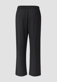 Schwarze, knöchellange Hosen aus strukturiertem Stoff, mit elastischem Bund und lockerem Schnitt. Keine zusätzlichen Verzierungen.