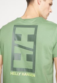 Helly Hansen CORE GRAPHIC - Camiseta estampada - jade
