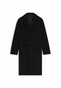Black wool coat featuring a notched collar, three front buttons, two large pockets, and a slight A-line silhouette.