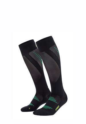 Black compression socks with green diagonal stripes and mesh panels, featuring a reinforced toe and arch support for comfort and support.