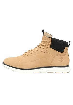 Tan high-top leather sneaker with black padded collar, black and white sole, and embossed brand logo on side.