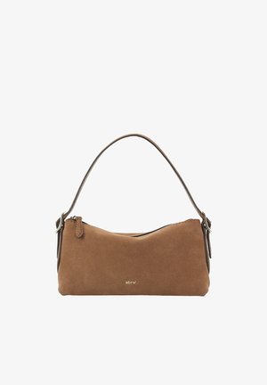 Brown suede handbag with a curved shape, thin shoulder strap, and gold logo. Zip closure and minimalistic design. Smooth texture.