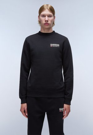 Black sweatshirt with round neck, long sleeves, and ribbed cuffs. Features a logo patch on the chest. Smooth texture, casual fit.