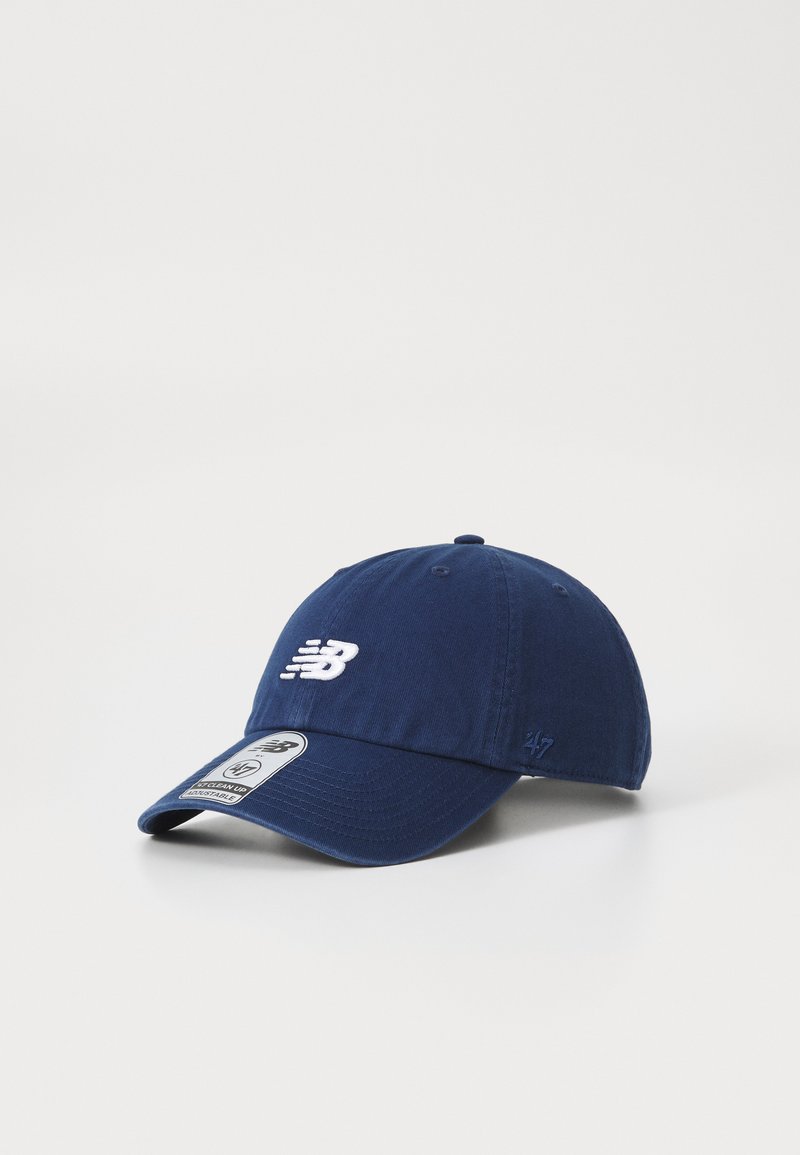 Navy blue cap made of fabric with a curved brim. Features white embroidered logo and adjustable strap at the back. Clean, simple design.