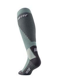 Calza compressiva in teal e grigio scuro, caratterizzata da una texture a coste, punta rinforzata, design sagomato e logo nella parte superiore.