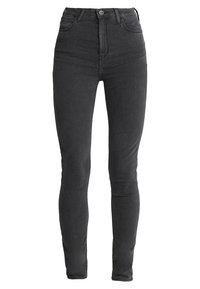 Jeans skinny de talle alto en negro, fabricados en denim, con una textura suave, diseño tradicional de cinco bolsillos y cierre de cremallera con botón.