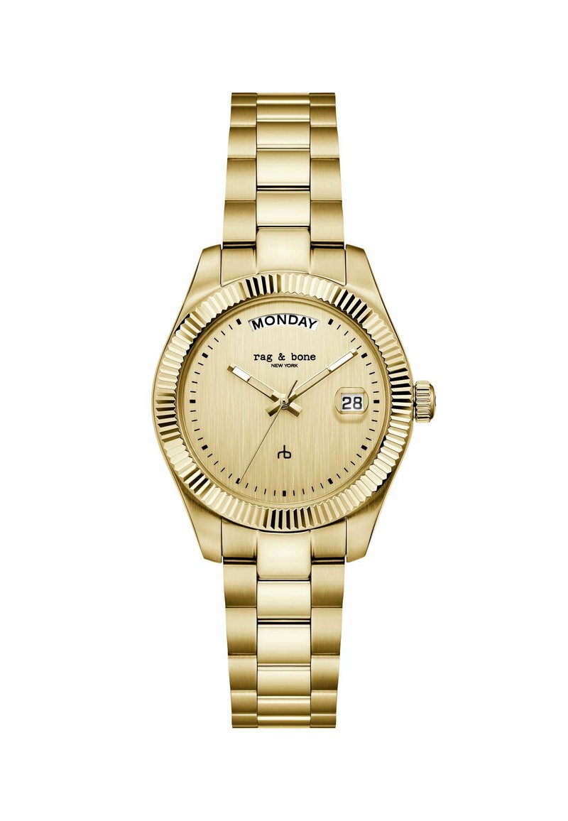 Goudkleurige metalen polshorloge met schakelarmband, gegroefde bezel, dagweergave op 12 uur, datumvenster op 3 uur en analoge wijzers.