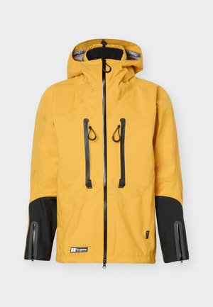Gelbe Outdoorjacke mit schwarzen Details an Ärmeln und Brustreißverschlüssen, Kapuze, durchgehendem Frontreißverschluss und Berghaus-Logo nahe dem Saum.