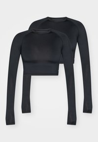 Black cropped long-sleeve tops made from smooth, stretch fabric. Features a crew neckline and contrasting seams for added detail.