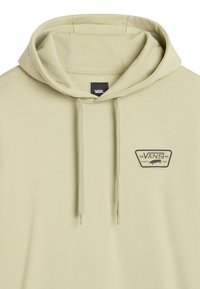 Sudadera verde claro con cordones, que presenta un parche del logo de Vans en el lado izquierdo del pecho. Fabricada en suave algodón, con un ajuste relajado y un bolsillo tipo canguro.
