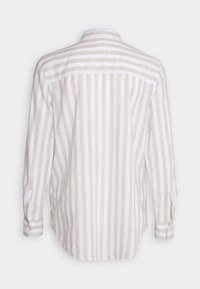 Long-sleeve shirt in light beige and white striped linen, featuring a button-down collar and cuffed sleeves.