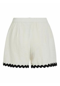 White shorts with an elastic waistband, featuring a textured fabric and black scalloped trim along the hem. Lightweight and loose-fitting.