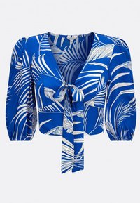 Blusa blu con motivo a foglie di palma bianche, dettaglio davanti con fiocco, scollatura a V e maniche a sbuffo. Realizzata in tessuto leggero e morbido.