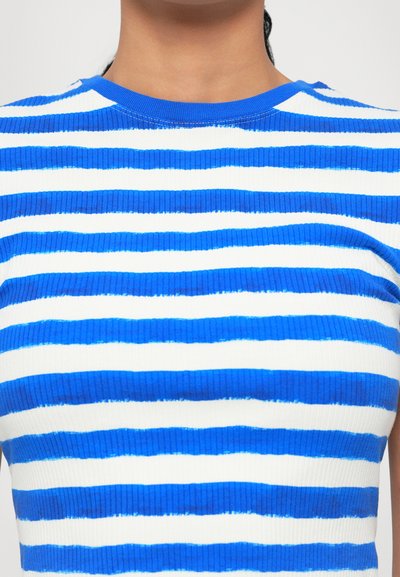 Ribbed top featuring alternating thick blue and white stripes, round neckline, and textured fabric.