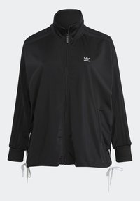 Musta vetoketjullinen takki korkealla kauluksella, valmistettu sileästä kankaasta, jossa sivutaskut, resorikahleet ja pieni valkoinen logo rinnassa.